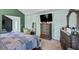 Spacious main bedroom with hardwood dresser and a view into the dressing area at 543 Walnut Way, Palmetto, GA 30268