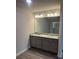 Bathroom with granite countertops, double sinks, and a large mirror at 6426 Rosetta Drive # 53, South Fulton, GA 30331