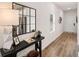 Inviting entryway featuring modern decor, a stylish console table, and wood-look floors at 6426 Rosetta Drive # 53, South Fulton, GA 30331