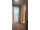 Hallway leading to bedroom, with view of laundry room and natural light at 6426 Rosetta Drive # 53, South Fulton, GA 30331