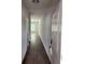 Hallway with wood-look floors leading to a bright living space with lots of natural light at 6426 Rosetta Drive # 53, South Fulton, GA 30331