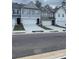Street view of new construction townhomes with driveways and landscaping at 6426 Rosetta Drive # 53, South Fulton, GA 30331