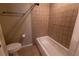 Cozy bathroom with tiled tub and neutral decor at 177 Nw Amherst Pl, Atlanta, GA 30327