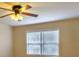 Cozy bedroom featuring wood-look flooring, a ceiling fan and a window with blinds at 177 Nw Amherst Pl, Atlanta, GA 30327