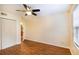 Bright bedroom with a ceiling fan, window, and closet at 177 Nw Amherst Pl, Atlanta, GA 30327