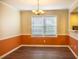 Inviting dining room featuring a stylish light fixture and large window at 177 Nw Amherst Pl, Atlanta, GA 30327