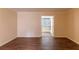 Spacious living room showcasing wood floors and neutral-colored walls leading to sunroom at 177 Nw Amherst Pl, Atlanta, GA 30327
