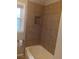 Tiled bathtub featuring a built-in shower niche at 2598 Miriam Ln, Decatur, GA 30032