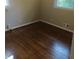 A simple bedroom space with hardwood floors and natural light at 2598 Miriam Ln, Decatur, GA 30032