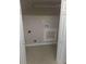 Small laundry room with bi-fold doors, utility connections and painted walls at 2598 Miriam Ln, Decatur, GA 30032
