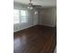 A bright living room with hardwood flooring, large windows and a white front door at 2598 Miriam Ln, Decatur, GA 30032