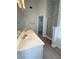 Spacious bathroom with double sinks, a walk-in shower, and a glimpse of a walk-in closet at 3058 Arden Ridge Ter, Suwanee, GA 30024