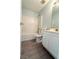 Bright bathroom featuring a tub-shower, toilet, light countertop and modern vanity at 3058 Arden Ridge Ter, Suwanee, GA 30024
