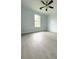 Bright bedroom with a large window and elegant ceiling fan, offering a tranquil retreat at 3058 Arden Ridge Ter, Suwanee, GA 30024