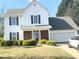 Charming two-story home boasts white siding, black shutters, and a well-manicured lawn at 3058 Arden Ridge Ter, Suwanee, GA 30024