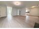Bright living room featuring stylish flooring, recessed lighting, and seamless flow to other areas at 3058 Arden Ridge Ter, Suwanee, GA 30024