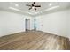 Bright primary bedroom featuring a tray ceiling and dual closets at 5215 Virginia Ave, Cumming, GA 30041