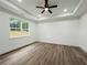 Spacious bedroom features a tray ceiling with fan and recessed lighting at 5215 Virginia Ave, Cumming, GA 30041