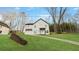 Charming two-story home with landscaped front yard, stone retaining wall, and private driveway at 5215 Virginia Ave, Cumming, GA 30041