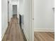 Bright hallway featuring sleek flooring and modern railing at 5215 Virginia Ave, Cumming, GA 30041