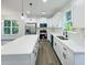 Modern kitchen with stainless appliances, quartz countertops, and ample cabinet space at 5215 Virginia Ave, Cumming, GA 30041