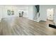 Large living room with an open layout, stairs, and modern finishes at 5215 Virginia Ave, Cumming, GA 30041