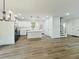 Bright, open-concept living and kitchen area with stainless appliances and modern finishes at 5215 Virginia Ave, Cumming, GA 30041