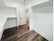 Walk-in closet with white walls, shelves, and luxury vinyl flooring at 5215 Virginia Ave, Cumming, GA 30041