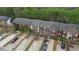 An aerial view of brick townhomes featuring multiple parking spaces at 5587 Strathmoor Manor Cir, Lithonia, GA 30058