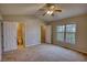 Bedroom with a glimpse of the en-suite bathroom, a spacious closet and big window at 5587 Strathmoor Manor Cir, Lithonia, GA 30058