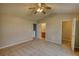 Bedroom showcasing bathroom and closet entrances, a spacious layout with a large window at 5587 Strathmoor Manor Cir, Lithonia, GA 30058