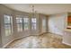 Bright dining area with a chandelier and many windows at 5587 Strathmoor Manor Cir, Lithonia, GA 30058