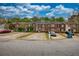 Red brick townhomes with private parking and landscaping at 5587 Strathmoor Manor Cir, Lithonia, GA 30058