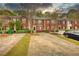 Charming brick townhomes with landscaped front yards and individual parking spaces at 5587 Strathmoor Manor Cir, Lithonia, GA 30058
