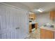 Galley kitchen with modern appliances and pantry storage at 5587 Strathmoor Manor Cir, Lithonia, GA 30058