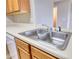 Close up view of kitchen sink and white laminate countertop at 5587 Strathmoor Manor Cir, Lithonia, GA 30058