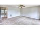 Spacious living room with neutral carpet, awaiting your personal touch and décor at 5587 Strathmoor Manor Cir, Lithonia, GA 30058
