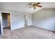 Large carpeted main bedroom boasts a vaulted ceiling, and multiple entry doors at 5587 Strathmoor Manor Cir, Lithonia, GA 30058