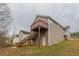 View of the house with wooden deck and a staircase at 1080 Abington Ct, Douglasville, GA 30134