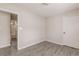 Cozy bedroom boasts wood-look floors, neutral walls, and ample closet space at 1080 Abington Ct, Douglasville, GA 30134