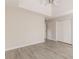 Spacious bedroom featuring gray laminate flooring, a ceiling fan, and ample closet space at 1080 Abington Ct, Douglasville, GA 30134