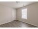 Bright bedroom features neutral walls, wood-look flooring, and a sunny window at 1080 Abington Ct, Douglasville, GA 30134