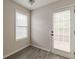 Bright dining area with gray vinyl floors and access to back yard at 1080 Abington Ct, Douglasville, GA 30134