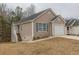 Charming home featuring a one-car garage and a well-maintained lawn at 1080 Abington Ct, Douglasville, GA 30134