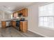 Bright kitchen featuring stainless appliances, wood cabinets and natural light from the window at 1080 Abington Ct, Douglasville, GA 30134
