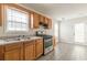 Bright kitchen with stainless appliances, wood cabinets and access to backyard at 1080 Abington Ct, Douglasville, GA 30134