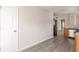 Bright kitchen featuring stainless steel appliances, wood cabinets, and gray laminate flooring at 1080 Abington Ct, Douglasville, GA 30134