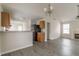 Bright living room featuring vaulted ceilings, gray vinyl floors and fireplace with stylish chandelier at 1080 Abington Ct, Douglasville, GA 30134
