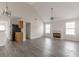 Bright living room featuring a fireplace and modern gray flooring at 1080 Abington Ct, Douglasville, GA 30134