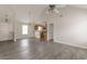 Open-concept living area flows into the kitchen with modern gray laminate flooring at 1080 Abington Ct, Douglasville, GA 30134